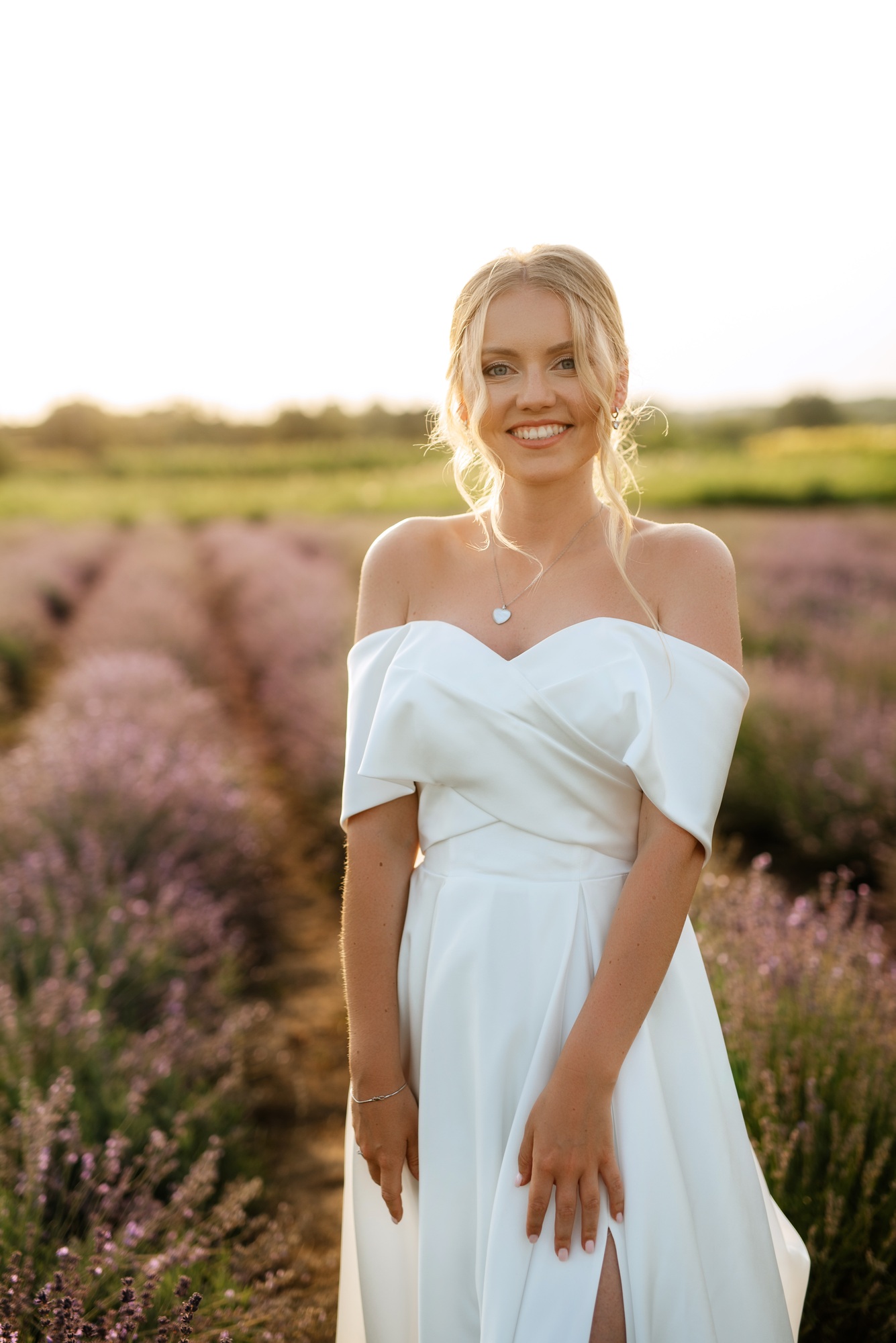 the bride in a white dress on the lavender field